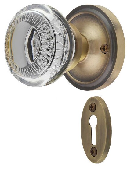 Classic Rosette Mortise-Lock Set with Ovolo Crystal-Glass Knobs and Keyhole in Antique Brass.